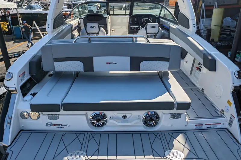 Slide: The Image of 2026 Chaparral 6 GTS boat interior with sleek seating and modern design. - 32