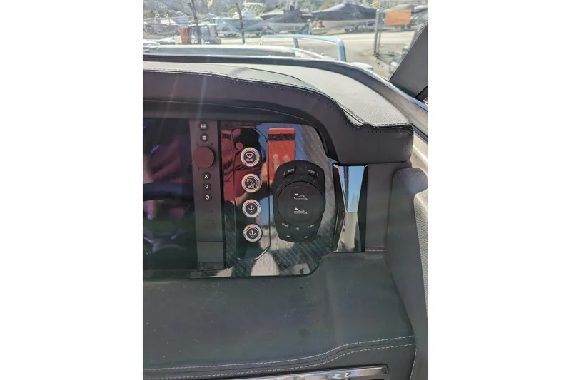 Slide: The Image of Dashboard controls of 2026 Chaparral 6 GTS boat, featuring sleek design and modern buttons. - 9