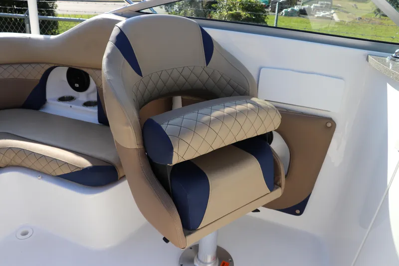Slide: The Image of 2019 Hurricane SunDeck 2486 OB boat interior with cushioned seating and modern design. - 21