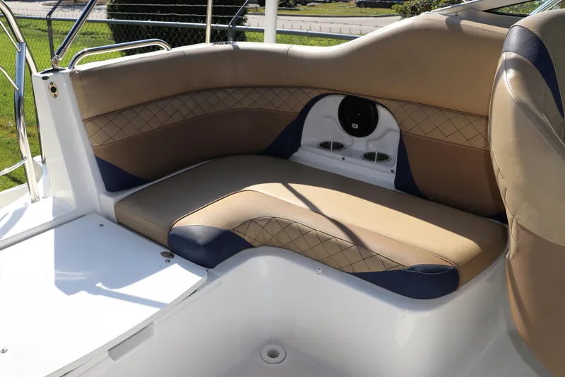 Slide: The Image of 2019 Hurricane SunDeck 2486 OB boat interior with tan and navy seating. - 29
