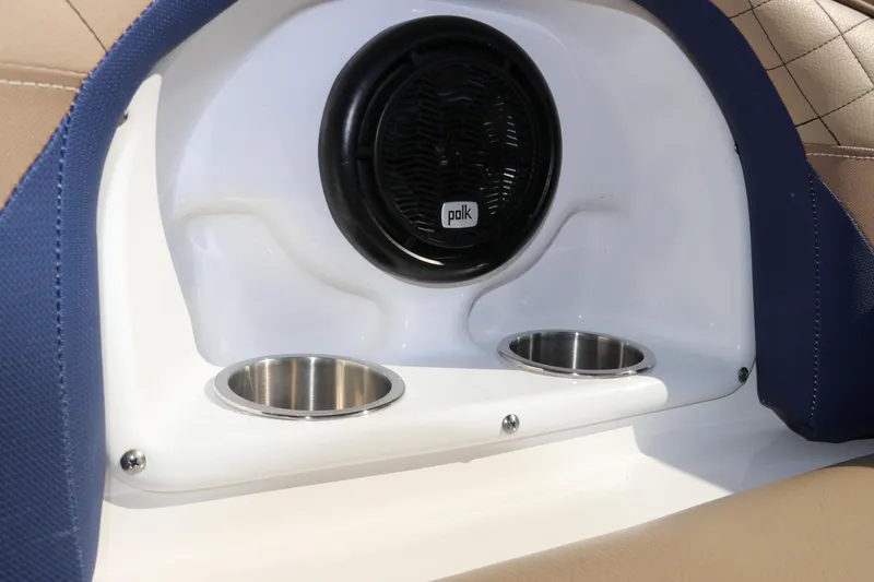 Slide: The Image of 2019 Hurricane SunDeck 2486 OB boat interior with Polk speaker and dual cup holders. - 31