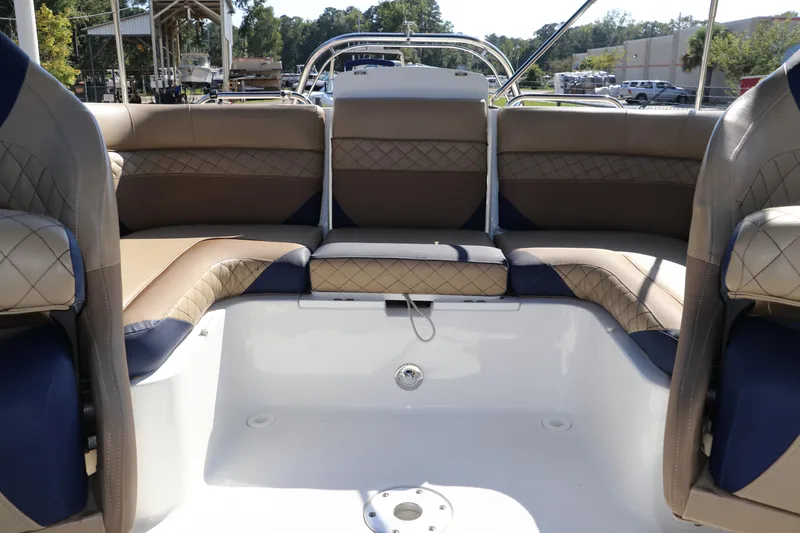 Slide: The Image of 2019 Hurricane SunDeck 2486 OB boat interior with luxurious seating and spacious layout. - 32