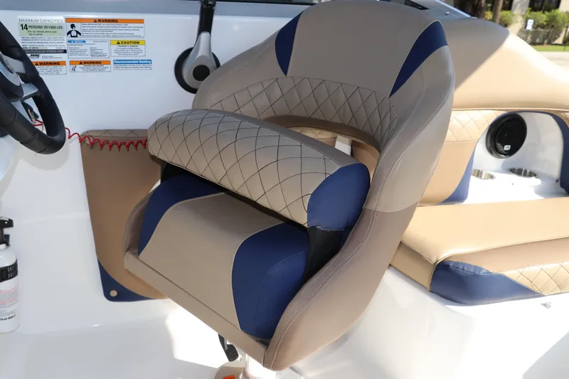 Slide: The Image of 2019 Hurricane SunDeck 2486 OB boat interior with beige and blue seating. - 35