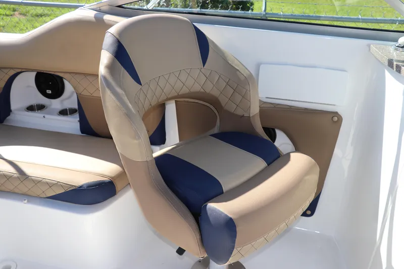Slide: The Image of 2019 Hurricane SunDeck 2486 OB boat interior with beige and blue seating. - 37