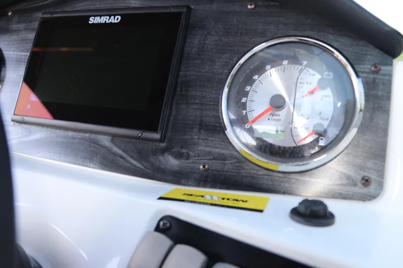 Slide: The Image of Dashboard of 2019 Hurricane SunDeck 2486 OB with Simrad display and tachometer. - 50