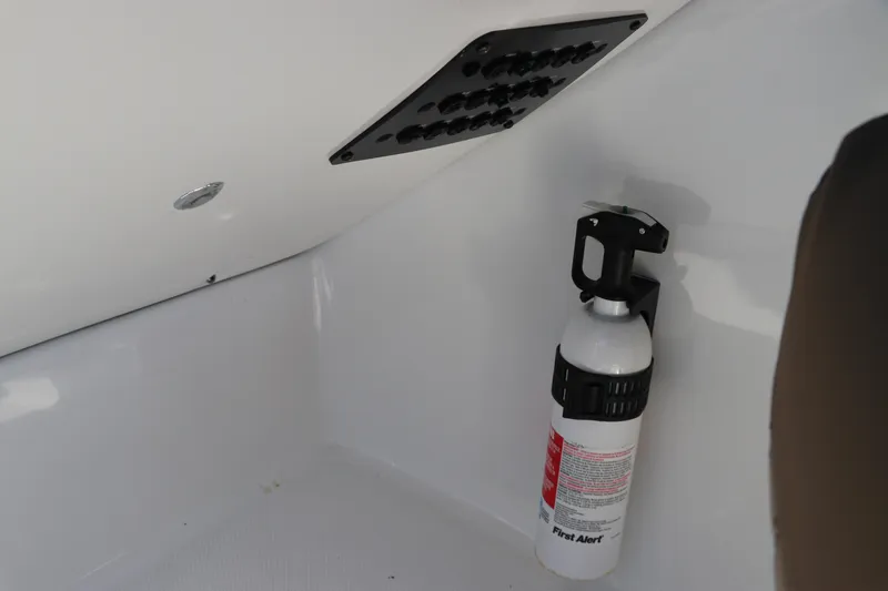 Slide: The Image of Fire extinguisher mounted on 2019 Hurricane SunDeck 2486 OB boat interior. - 53