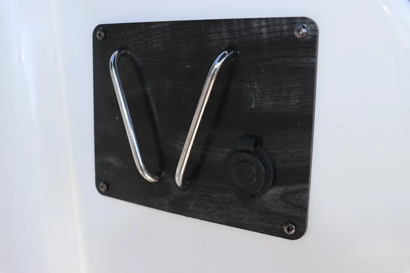 Slide: The Image of 2019 Hurricane SunDeck 2486 OB boat detail with metal hooks and 12V outlet. - 54