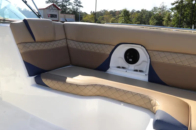 Slide: The Image of 2019 Hurricane SunDeck 2486 OB boat interior with tan and blue seating. - 64