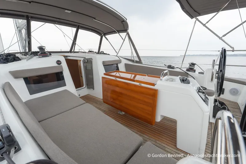 Slide: The Image of 2022 Jeanneau Sun Odyssey 410 cockpit with modern design and comfortable seating. - 11