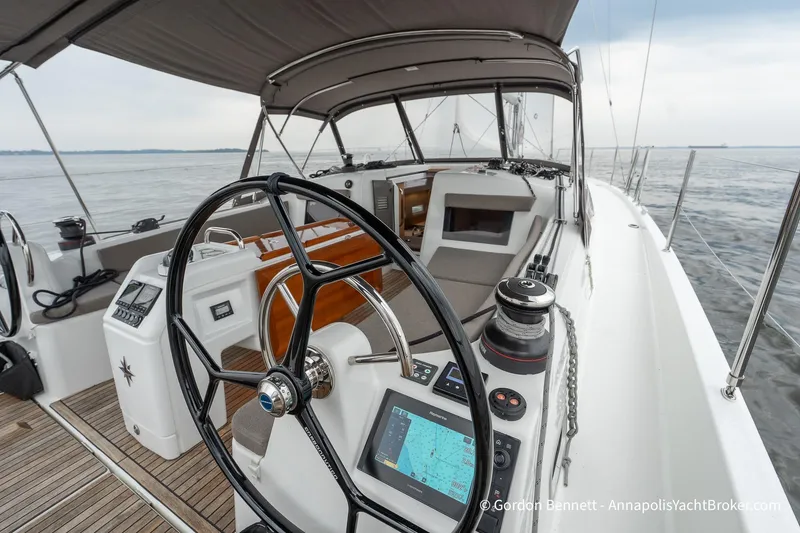 Slide: The Image of 2022 Jeanneau Sun Odyssey 410 yacht cockpit with navigation equipment and steering wheel. - 14