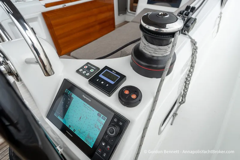 Slide: The Image of Cockpit of 2022 Jeanneau Sun Odyssey 410 with navigation equipment and winch. - 15