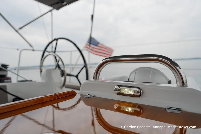 Slide: The Image of Jeanneau Sun Odyssey 410 yacht cockpit with American flag, 2022 model. - 16