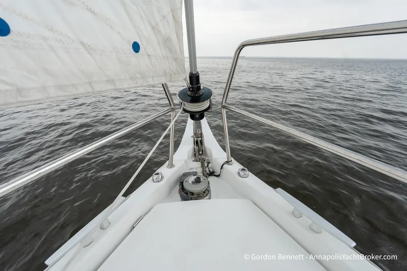 Slide: The Image of Jeanneau Sun Odyssey 410 sailboat bow on open water, 2022 model. - 20