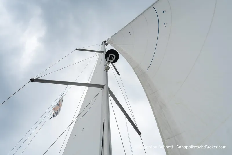 Slide: The Image of Sail of 2022 Jeanneau Sun Odyssey 410 yacht against cloudy sky. - 25