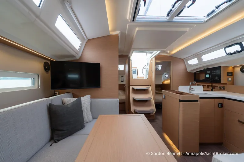 Slide: The Image of Interior of 2022 Jeanneau Sun Odyssey 410 yacht, featuring modern design and comfortable seating. - 34
