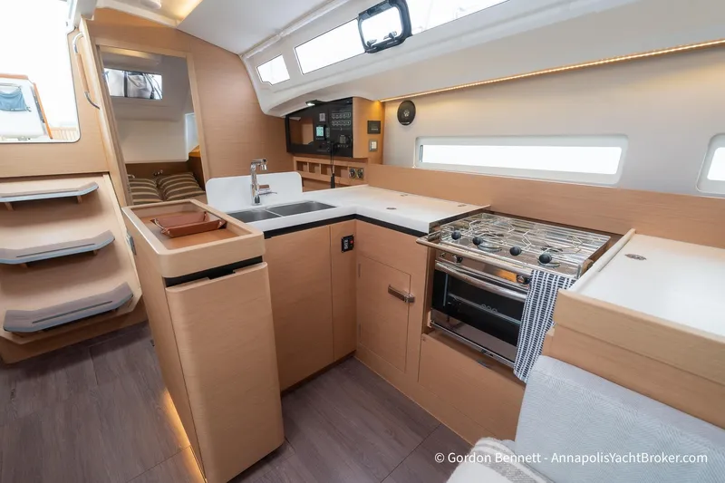 Slide: The Image of Modern interior of 2022 Jeanneau Sun Odyssey 410 yacht, featuring sleek kitchen and cozy cabin. - 42