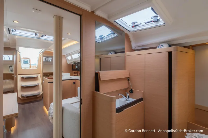 Slide: The Image of Interior of 2022 Jeanneau Sun Odyssey 410 yacht, featuring modern wood finish and skylights. - 52