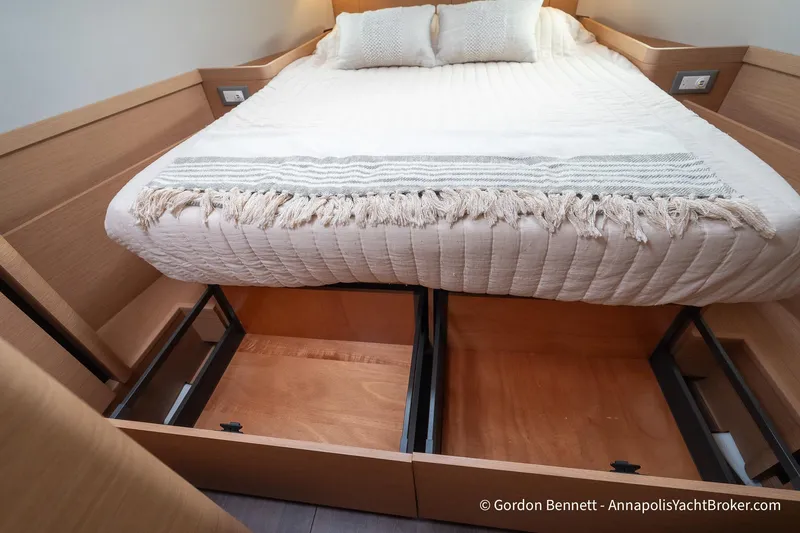 Slide: The Image of Cozy cabin bed with storage in 2022 Jeanneau Sun Odyssey 410 yacht. - 56