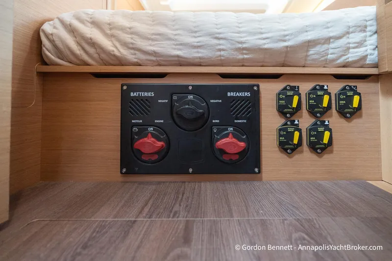 Slide: The Image of Electrical panel on 2022 Jeanneau Sun Odyssey 410 yacht, featuring battery switches and breakers. - 62