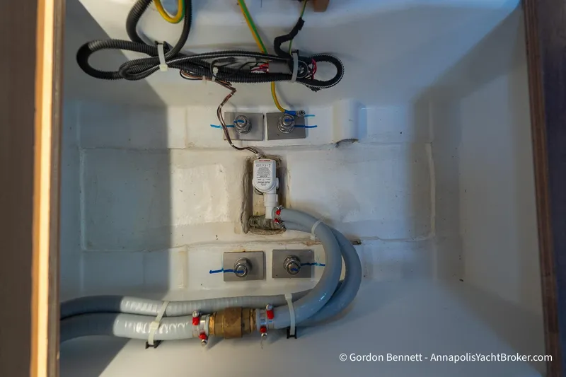Slide: The Image of Electrical and plumbing components inside 2022 Jeanneau Sun Odyssey 410 yacht. - 63