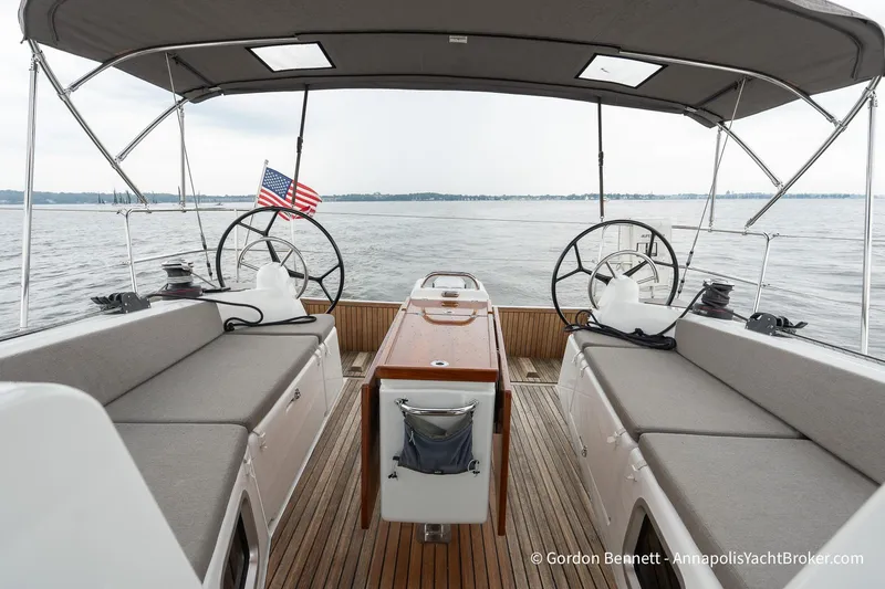 Slide: The Image of Jeanneau Sun Odyssey 410 yacht interior, 2022 model, featuring dual steering wheels and spacious seating. - 9