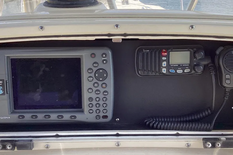 Slide: The Image of Electronics panel on 2001 Boston Whaler 260 Outrage with Garmin and Icom devices. - 15