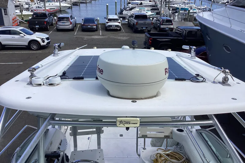 Slide: The Image of Boston Whaler 260 Outrage 2001 with radar and solar panels at marina. - 18