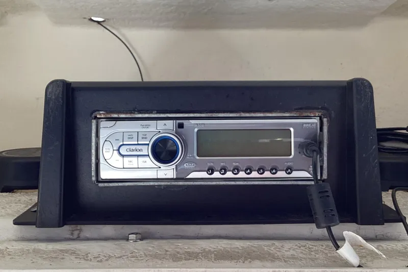 Slide: The Image of Clarion stereo system in a 2001 Boston Whaler 260 Outrage boat dashboard. - 20