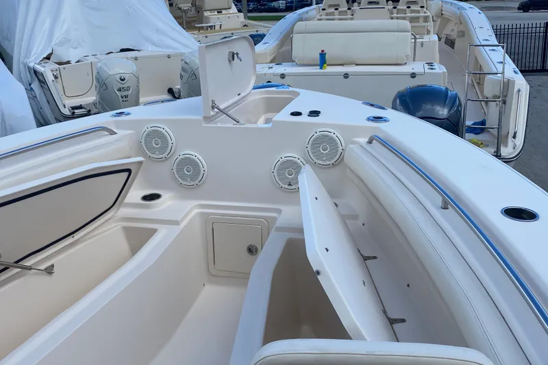 Slide: The Image of 2018 Grady-White Canyon 306 boat interior with storage compartments and speakers. - 2