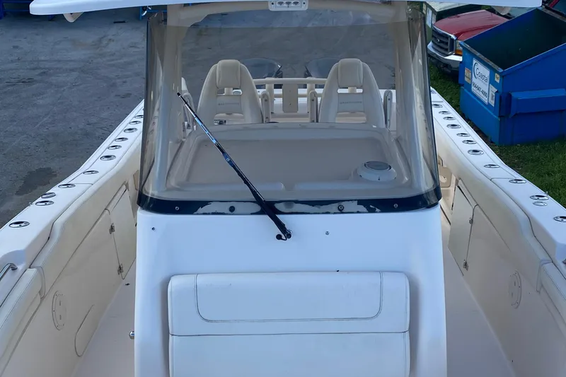 Slide: The Image of 2018 Grady-White Canyon 306 boat cockpit with seating and windshield. - 3