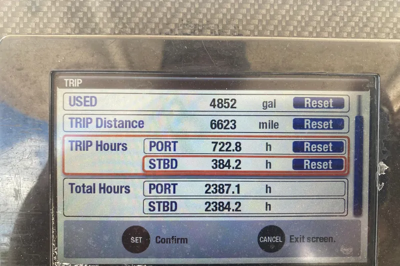 Slide: The Image of Display screen showing trip data for a 2018 Grady-White Canyon 306 boat. - 7