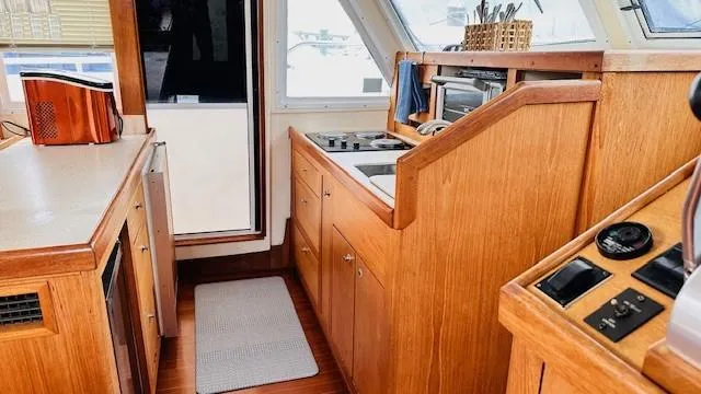 Slide: The Image of 1999 Mainship 430 Trawler helm with navigation instruments and controls. - 10