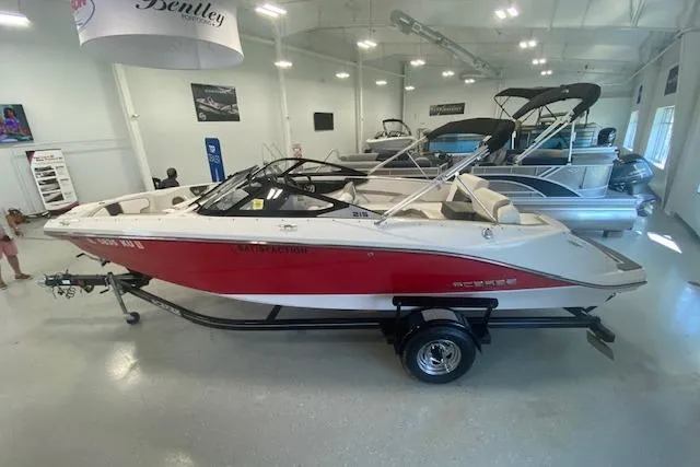 Slide: The Image of 2015 Scarab 215 boat displayed in showroom, front view. - 14