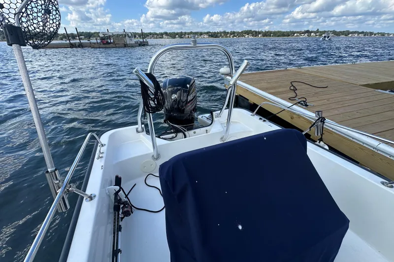 Slide: The Image of 2016 Boston Whaler 170 Montauk boat docked on a sunny day with scenic water view. - 6