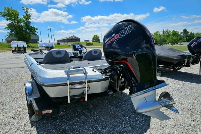 Slide: The Image of 2025 Ranger Z185 boat with Mercury Pro XS engine on gravel lot. - 11