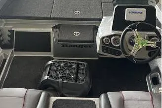 Slide: The Image of 2025 Ranger Z185 boat interior with steering wheel and dashboard controls. - 4