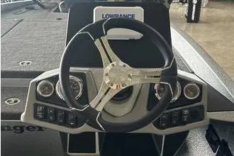 Slide: The Image of 2025 Ranger Z185 boat dashboard with steering wheel and Lowrance display. - 5