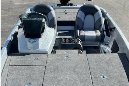 Slide: The Image of 2025 Ranger Z185 boat interior with dual seats and carpeted deck. - 7