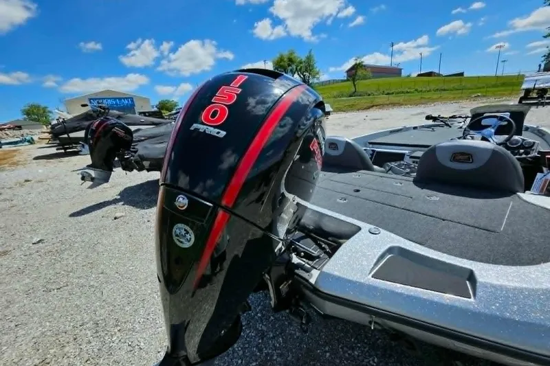 Slide: The Image of 2025 Ranger Z185 boat with 150 Pro engine, parked outdoors under a blue sky. - 8