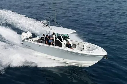 The Image of 2026 Blackfin 302 CC boat on trailer, parked near palm trees. - 1