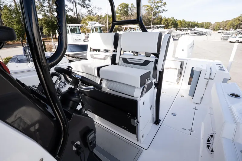 Slide: The Image of 2026 Blackfin 302 CC boat interior with modern seating and control panel. - 17