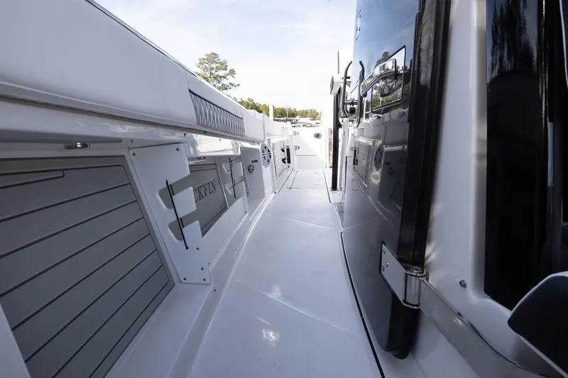 Slide: The Image of 2026 Blackfin 302 CC boat deck, sleek design with modern features and spacious walkway. - 26