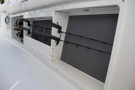 Slide: The Image of 2026 Blackfin 302 CC boat on trailer in marina setting. - 3