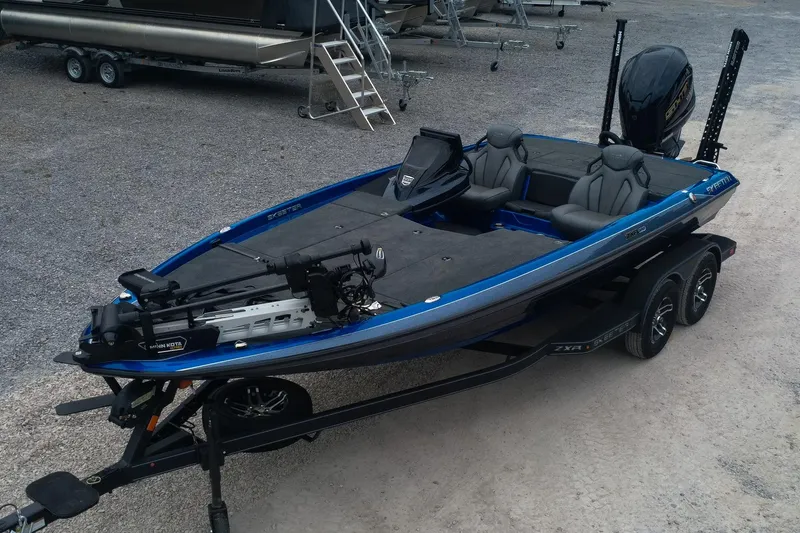 Slide: The Image of 2024 Skeeter ZXR20 fishing boat with dual consoles and trolling motor on trailer. - 1