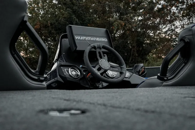 Slide: The Image of 2024 Skeeter ZXR20 boat cockpit with Humminbird electronics and steering wheel. - 16