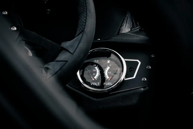 Slide: The Image of 2024 Skeeter ZXR20 dashboard with volt and fuel gauges, close-up view. - 18