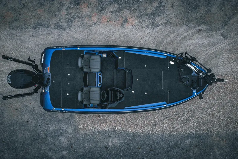 Slide: The Image of 2024 Skeeter ZXR20 fishing boat, aerial view, blue and black design, dual seats, motor visible. - 2