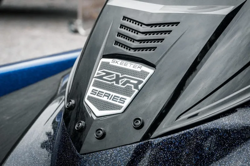 Slide: The Image of 2024 Skeeter ZXR20 boat badge with sleek design and vent details. - 22