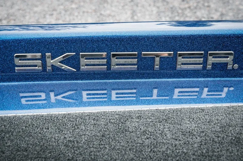 Slide: The Image of 2024 Skeeter ZXR20 logo on blue metallic surface, reflecting on water. - 23