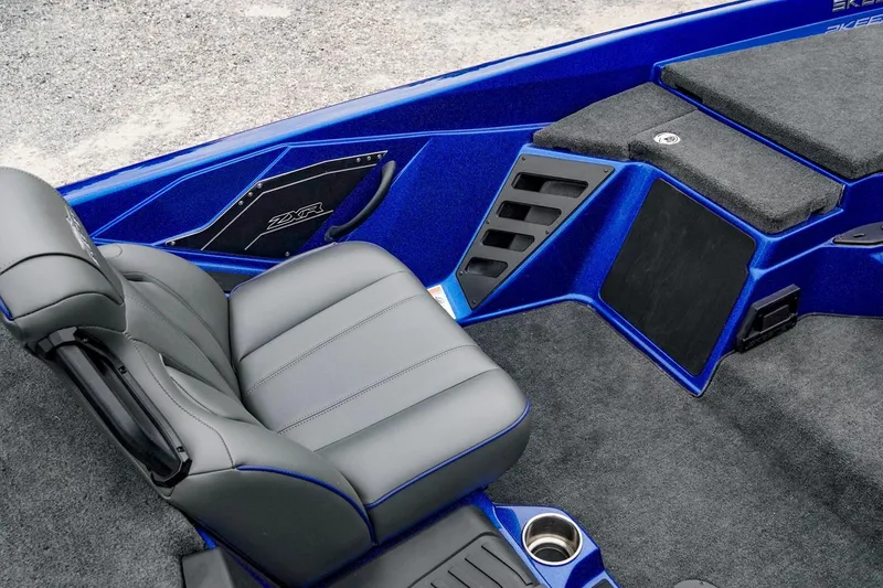 Slide: The Image of 2024 Skeeter ZXR20 boat interior with gray seating and blue accents. - 8
